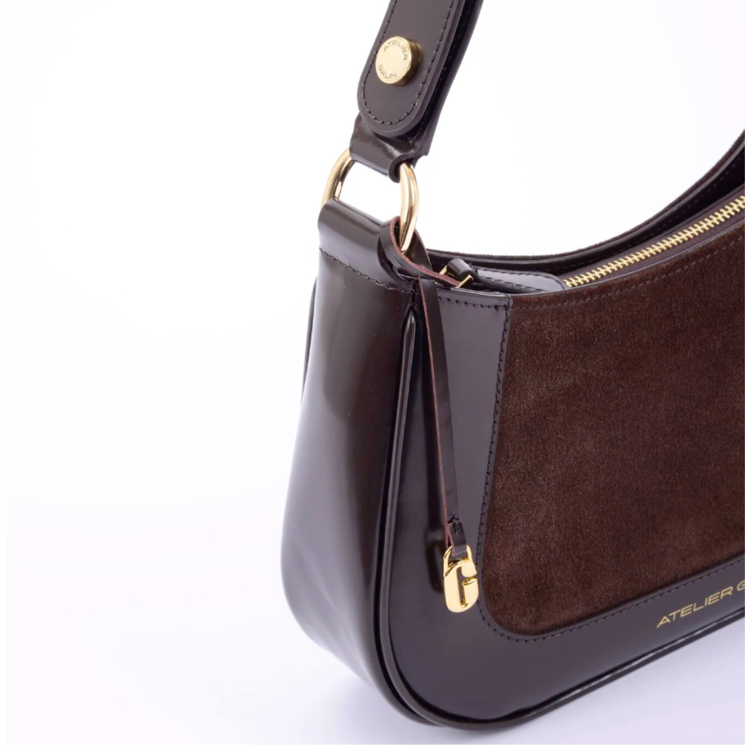 close up photo leather handbag brown suede